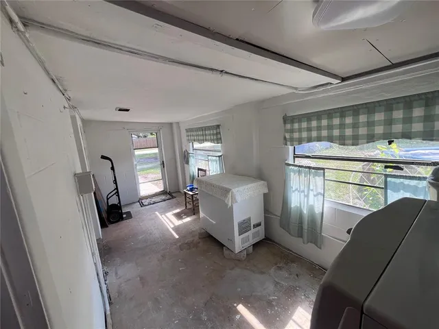 a view of a livingroom with furniture and windows