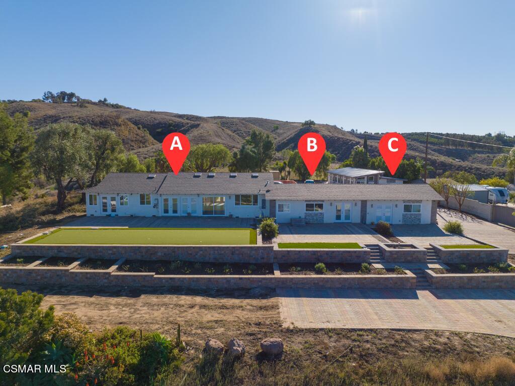 3836 Dalaway Drive Moorpark, CA 93021 - Photo 2 of 29 a swimming pool with outdoor seating and yard