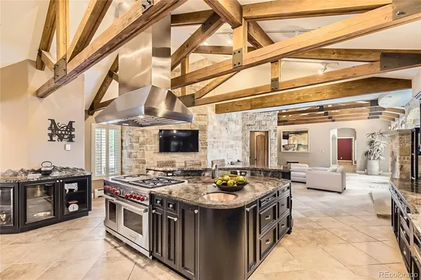 a kitchen with stainless steel appliances granite countertop a stove and a sink