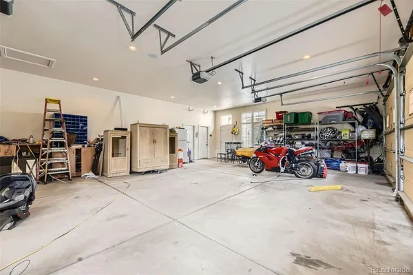 a view of a garage with parked cars