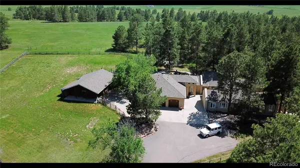 an aerial view of residential house with outdoor space