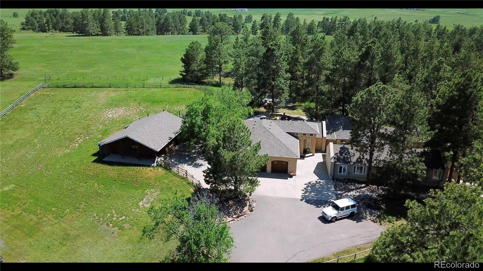 11274 East Manitou Road Franktown, CO 80116 - Photo 28 of 46 an aerial view of residential house with outdoor space