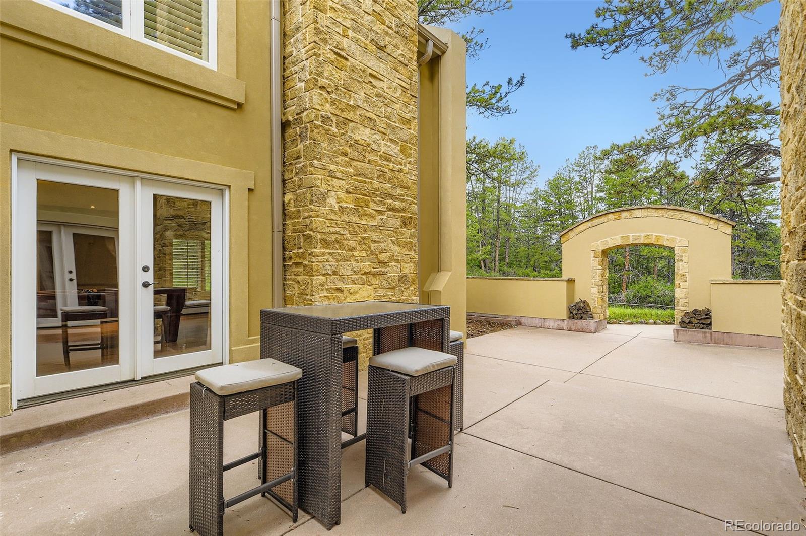 11274 East Manitou Road Franktown, CO 80116 - Photo 41 of 46 a view of a chair and table in the balcony