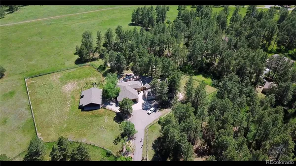 an aerial view of residential house with outdoor space