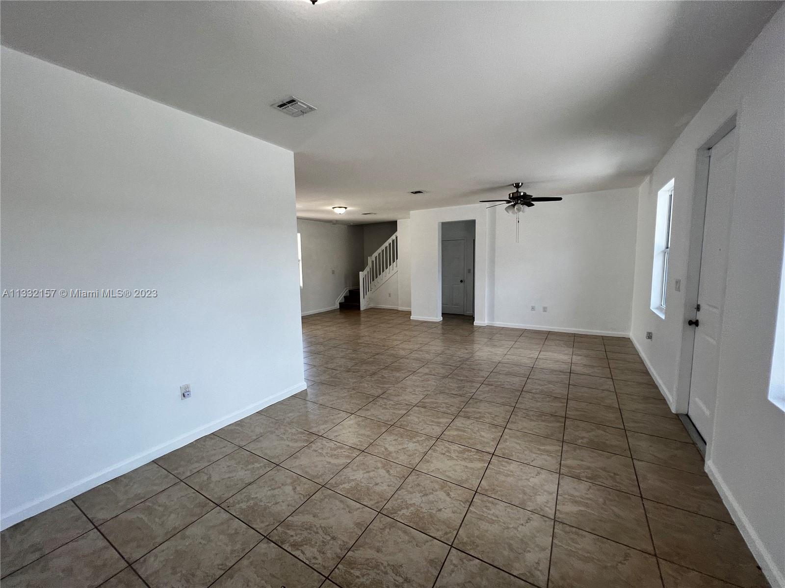 24257 Southwest 117th Avenue Homestead, FL 33032 - Photo 13 of 27 a view of a hallway