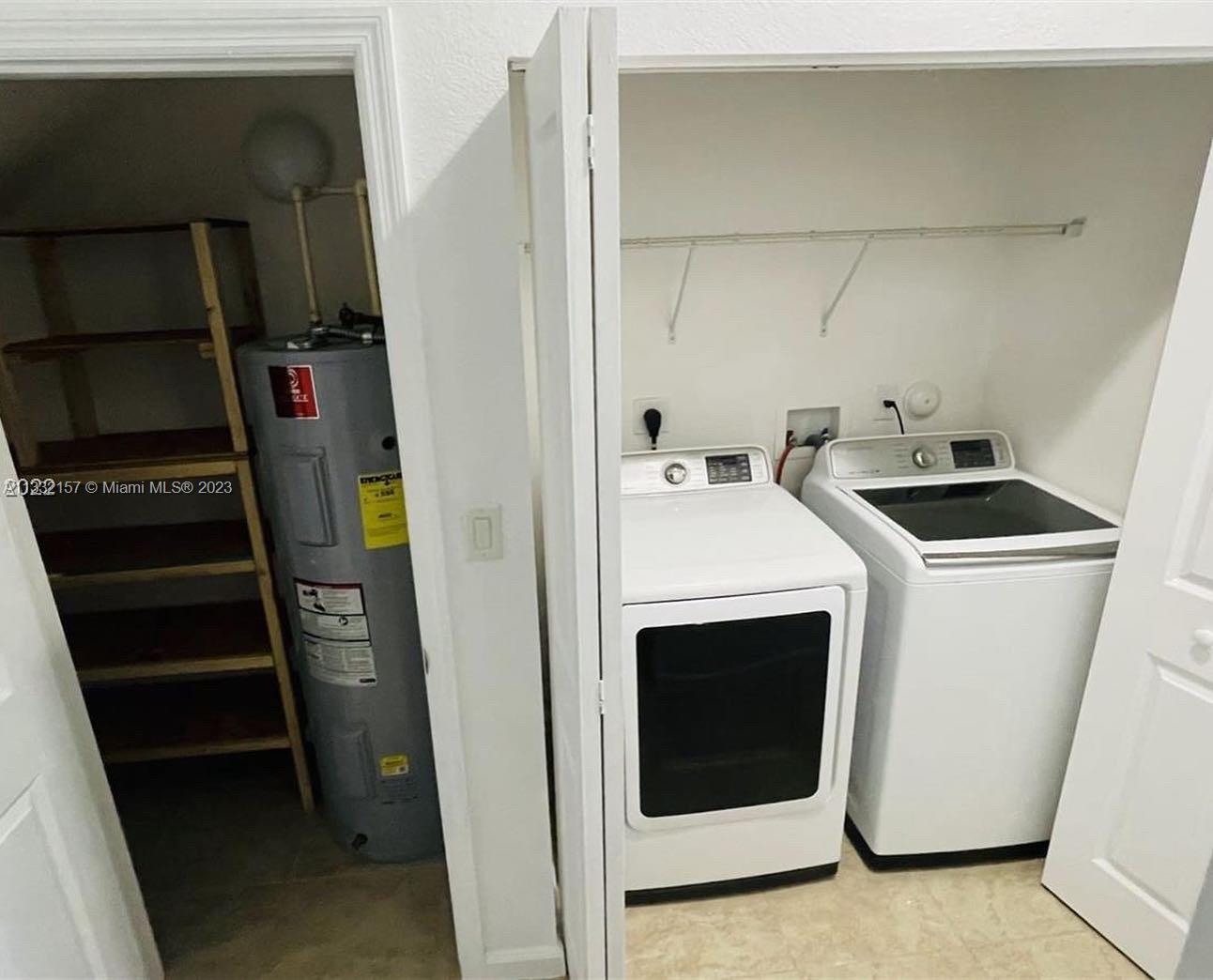 24257 Southwest 117th Avenue Homestead, FL 33032 - Photo 14 of 27 a utility room with dryer and washer
