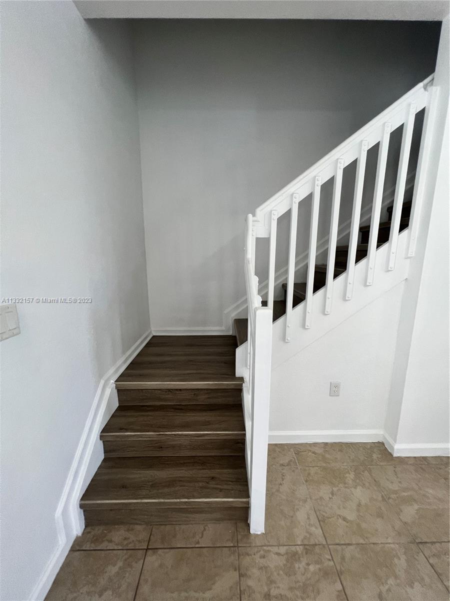 24257 Southwest 117th Avenue Homestead, FL 33032 - Photo 15 of 27 a view of entryway with staircase