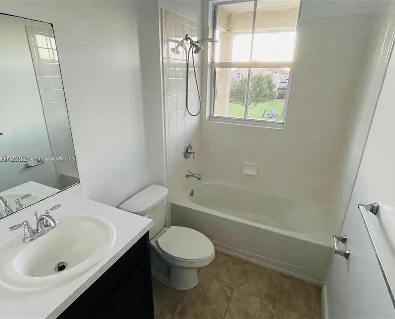 24257 Southwest 117th Avenue Homestead, FL 33032 - Photo 20 of 27 a bathroom with a sink toilet and shower