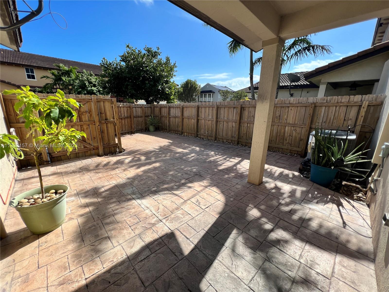 24257 Southwest 117th Avenue Homestead, FL 33032 - Photo 7 of 27 a view of a backyard with a patio