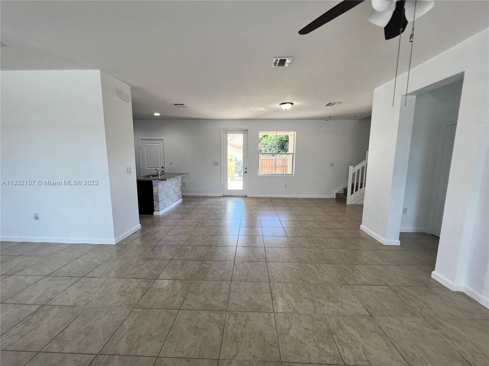 24257 Southwest 117th Avenue Homestead, FL 33032 - Photo 10 of 27 a view of livingroom with window