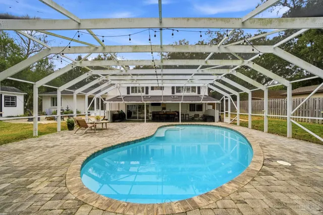 a view of a swimming pool with a patio