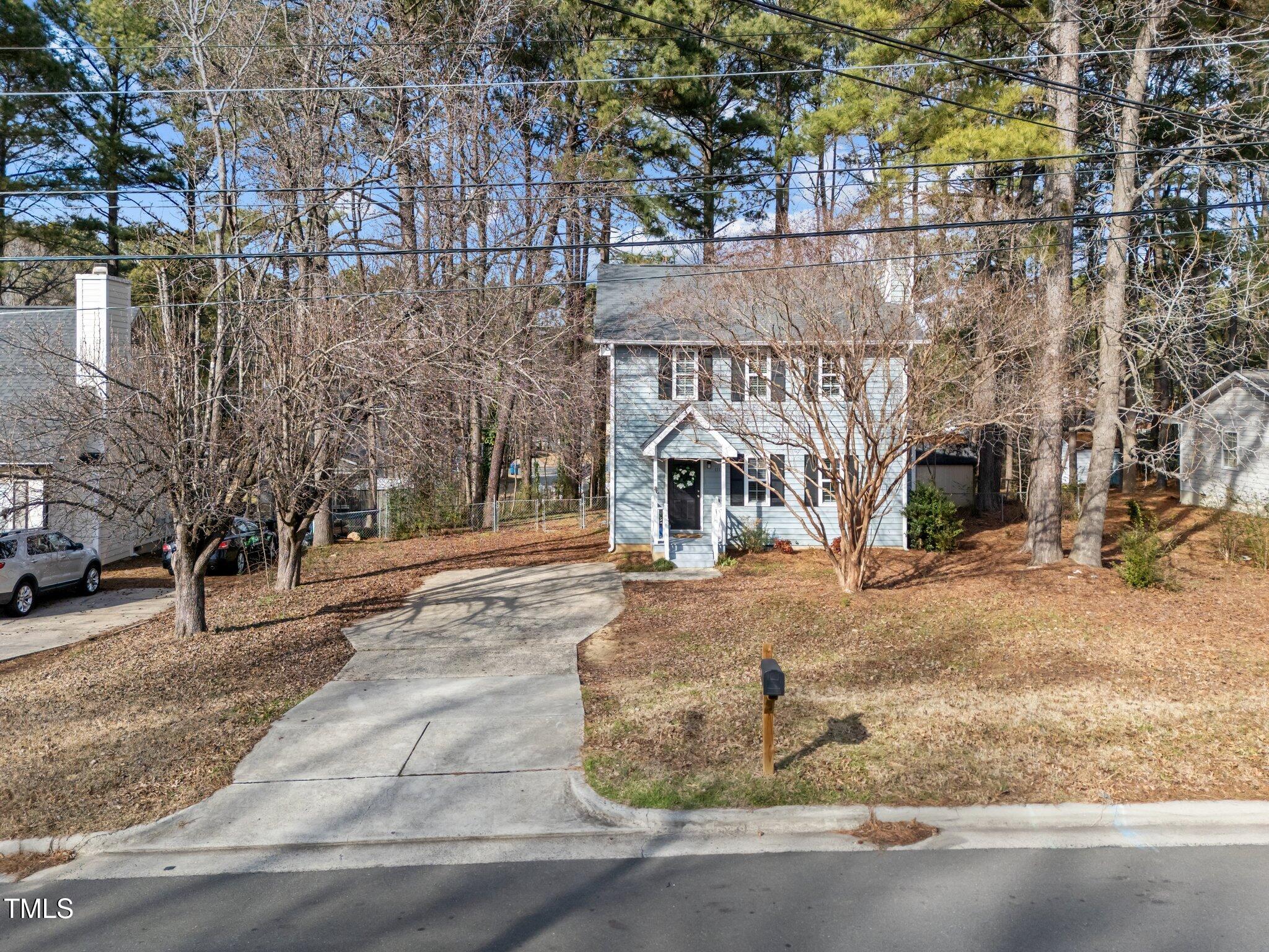 1112 Chalk Level Road Durham, NC 27704 - Photo 43 of 48 a view of a house with a yard