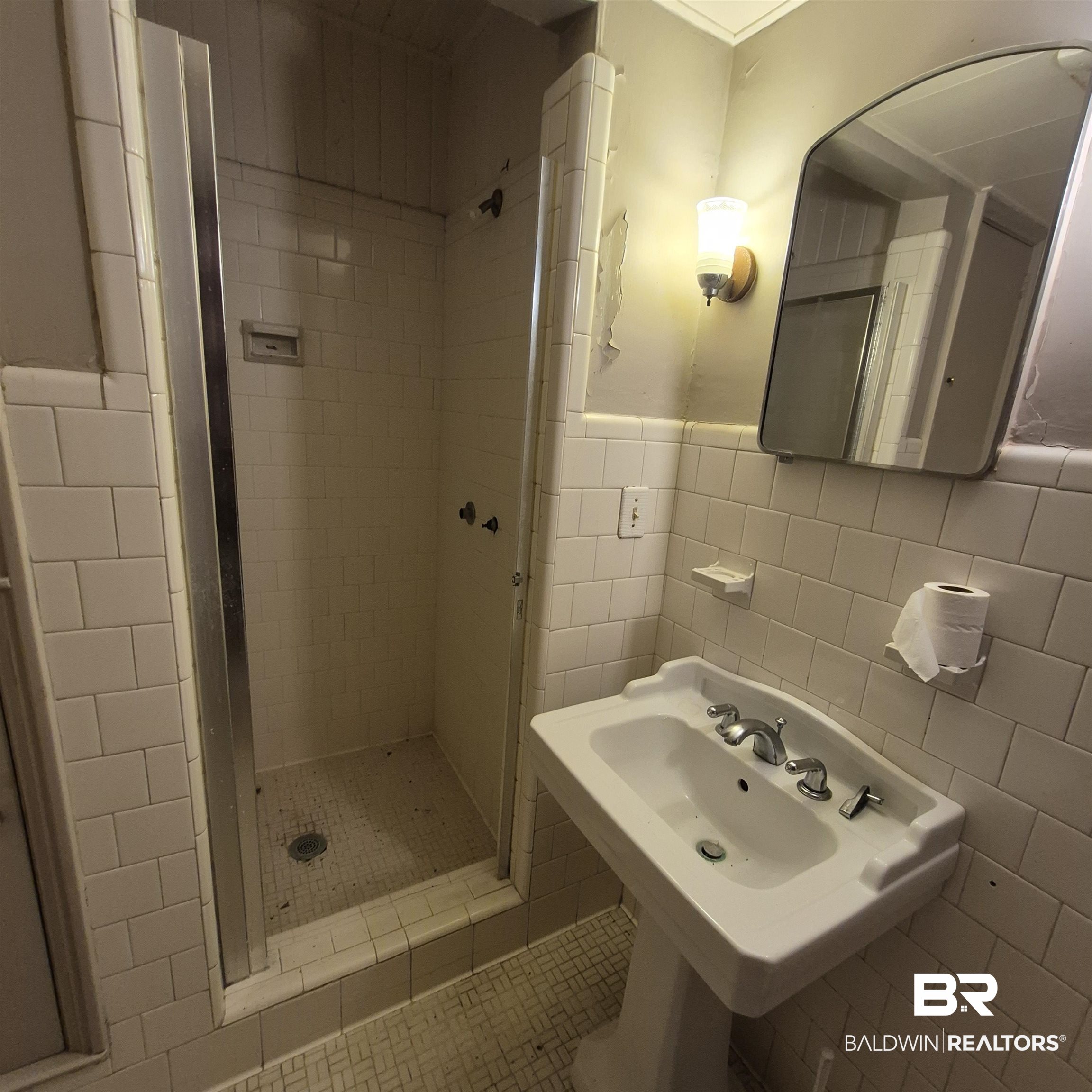308 Rural Street Evergreen, AL 36401 - Photo 31 of 40 Bathroom featuring a shower stall and tile walls