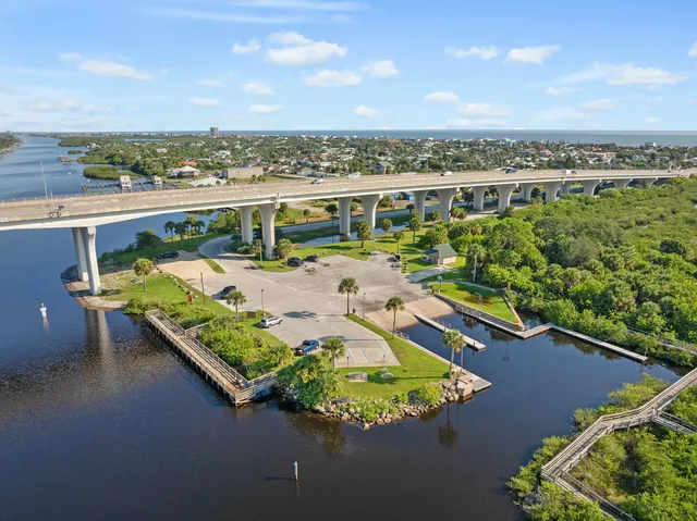 an aerial view of a house with a ocean view