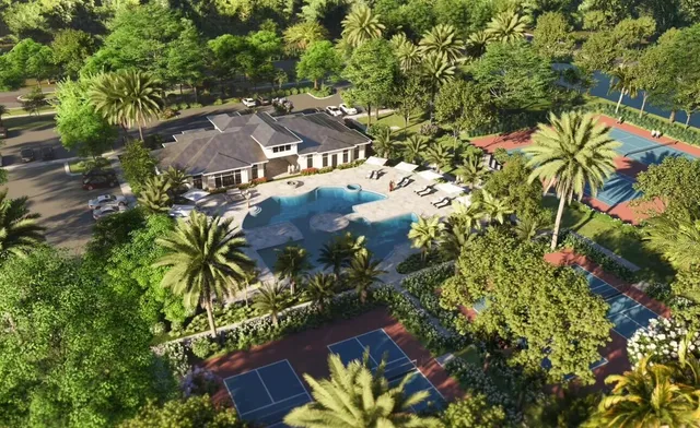 an aerial view of a house with a lake view