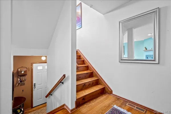 a view of a hallway with staircase