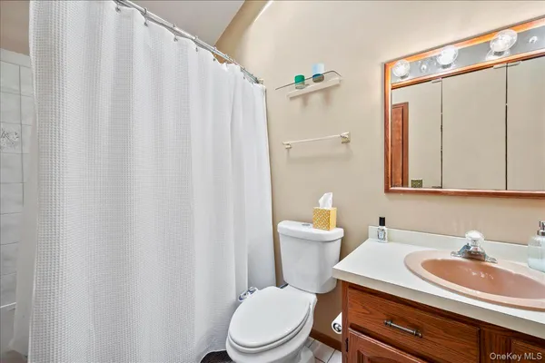 a bedroom with a bed and a table in it