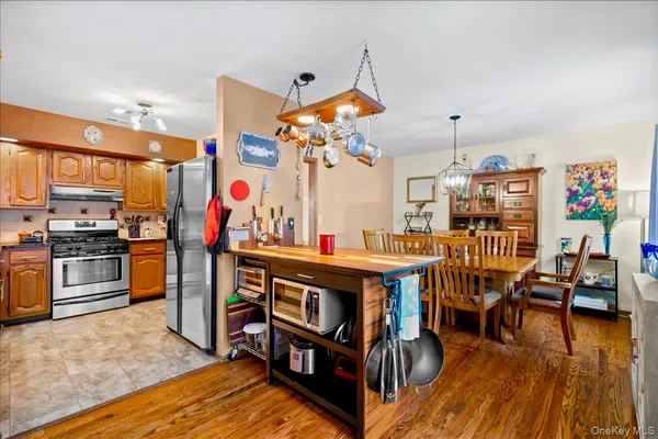 a view of a play room with furniture and wooden floor