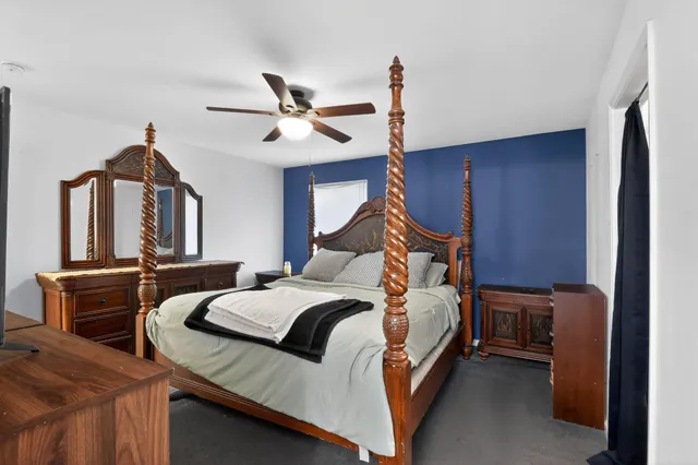 a bed room with a bed and furniture