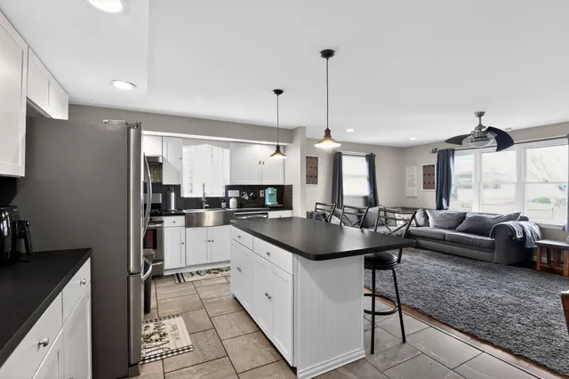a kitchen with counter space appliances and windows