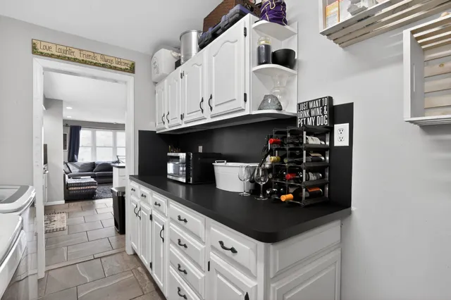 a kitchen with stainless steel appliances a sink and cabinets