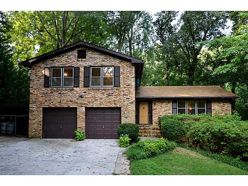 Exterior Front. 4 Sided Brick Home in Great Brookhaven Location. 1.1 Acres with Pool. 6 Bedrooms and 2 Car Garage.