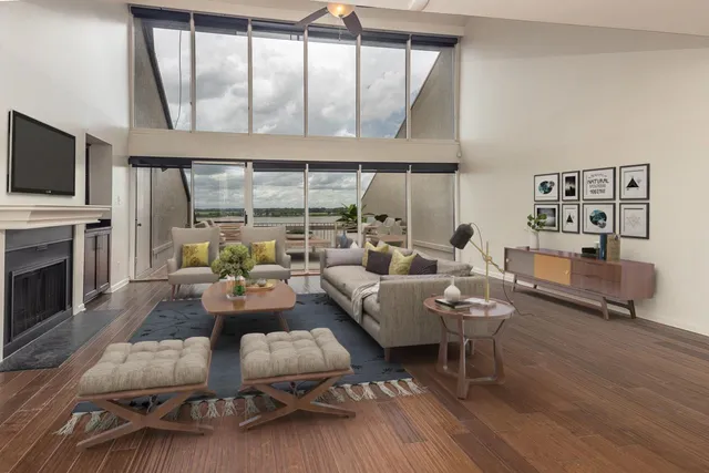 a living room with fireplace furniture and a flat screen tv