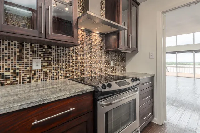 a kitchen with a stove and a microwave