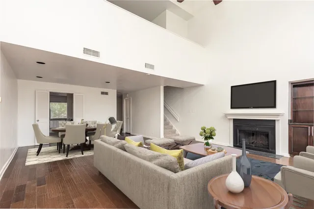 a living room with furniture flat screen tv and a fireplace