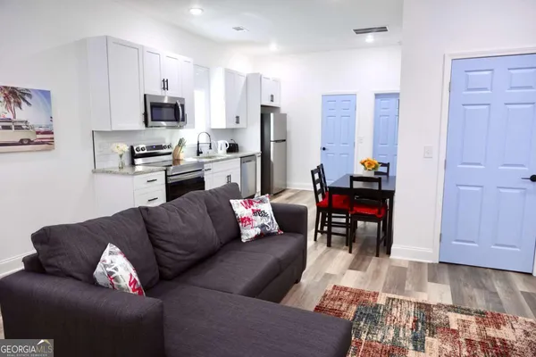 a living room with furniture and a couch