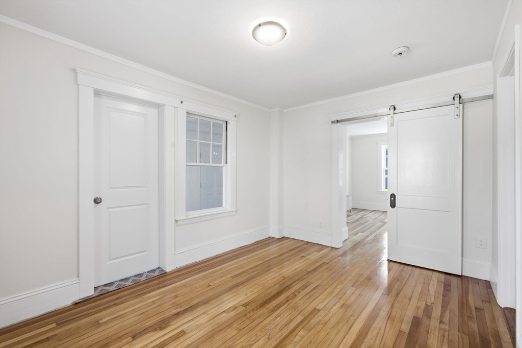 17 Rollinson Road Worcester, MA 01606 - Photo 19 of 41 wooden floor in an empty room with a window