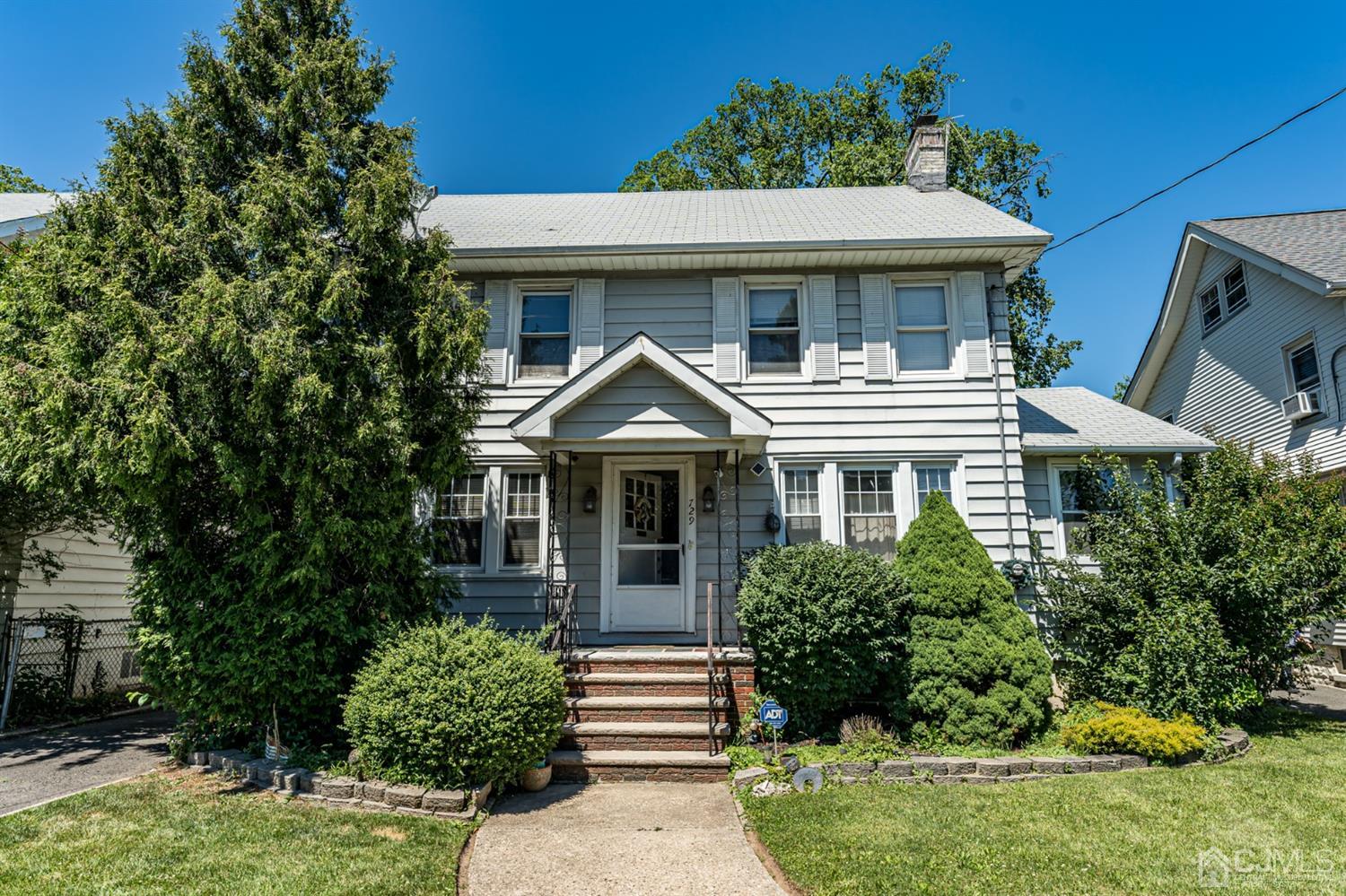 729 Livingston Road Elizabeth, NJ 07208 - Photo 1 of 26 a front view of a house with a yard