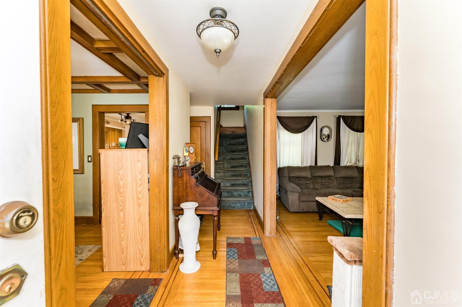 729 Livingston Road Elizabeth, NJ 07208 - Photo 2 of 26 a en suite bathroom with a granite countertop tub and a mirror
