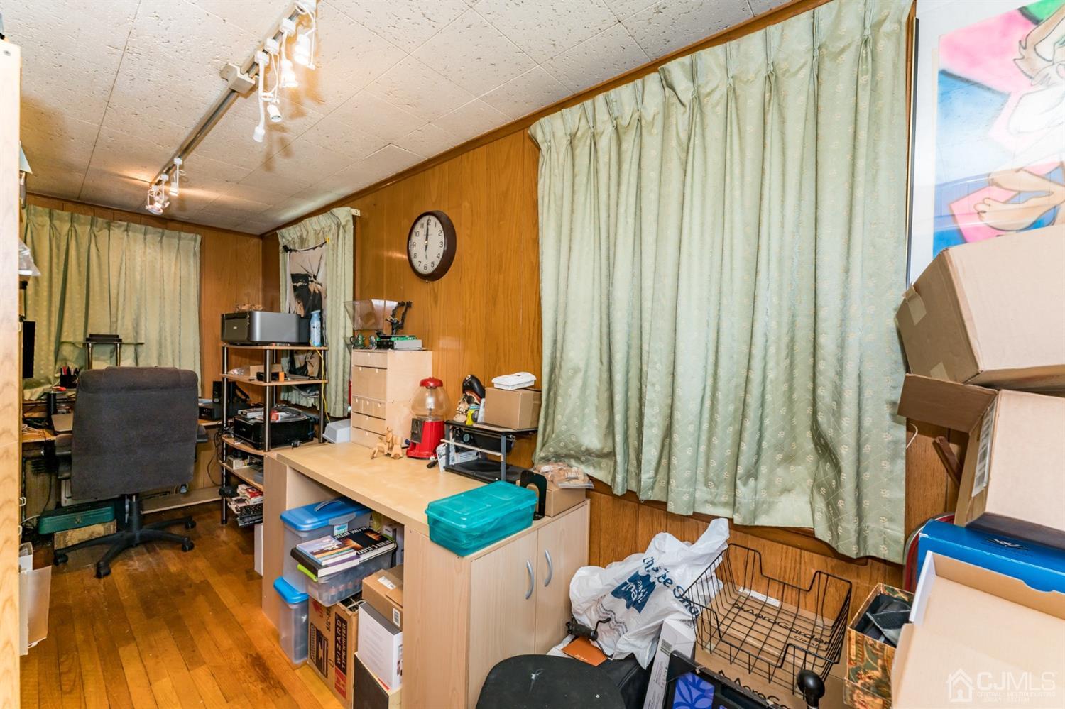 729 Livingston Road Elizabeth, NJ 07208 - Photo 13 of 26 a living room with furniture and a window