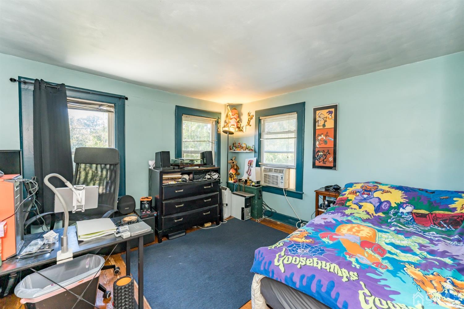 729 Livingston Road Elizabeth, NJ 07208 - Photo 17 of 26 a bedroom with a bed and a window