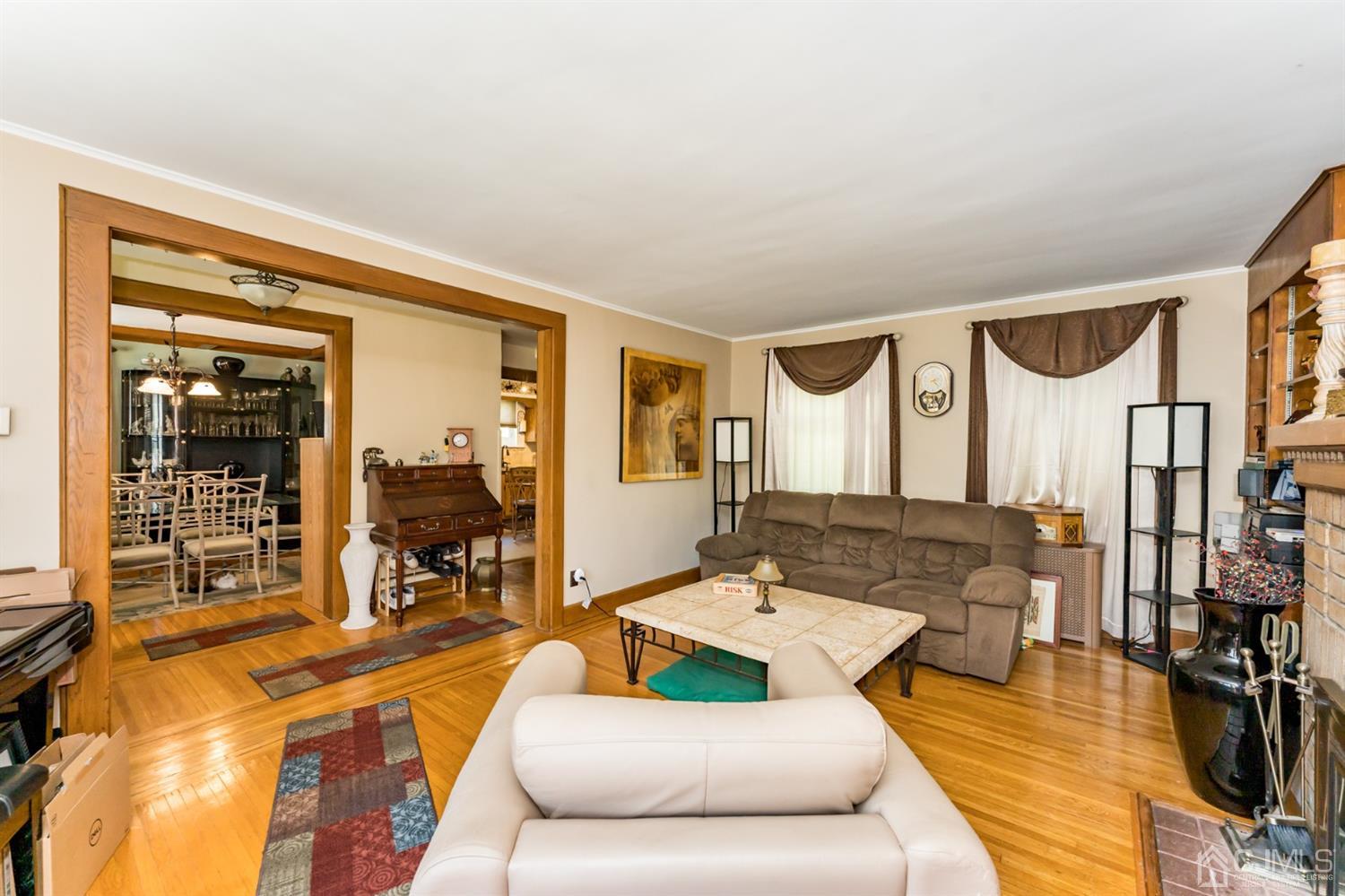 729 Livingston Road Elizabeth, NJ 07208 - Photo 3 of 26 a living room with furniture and a large window