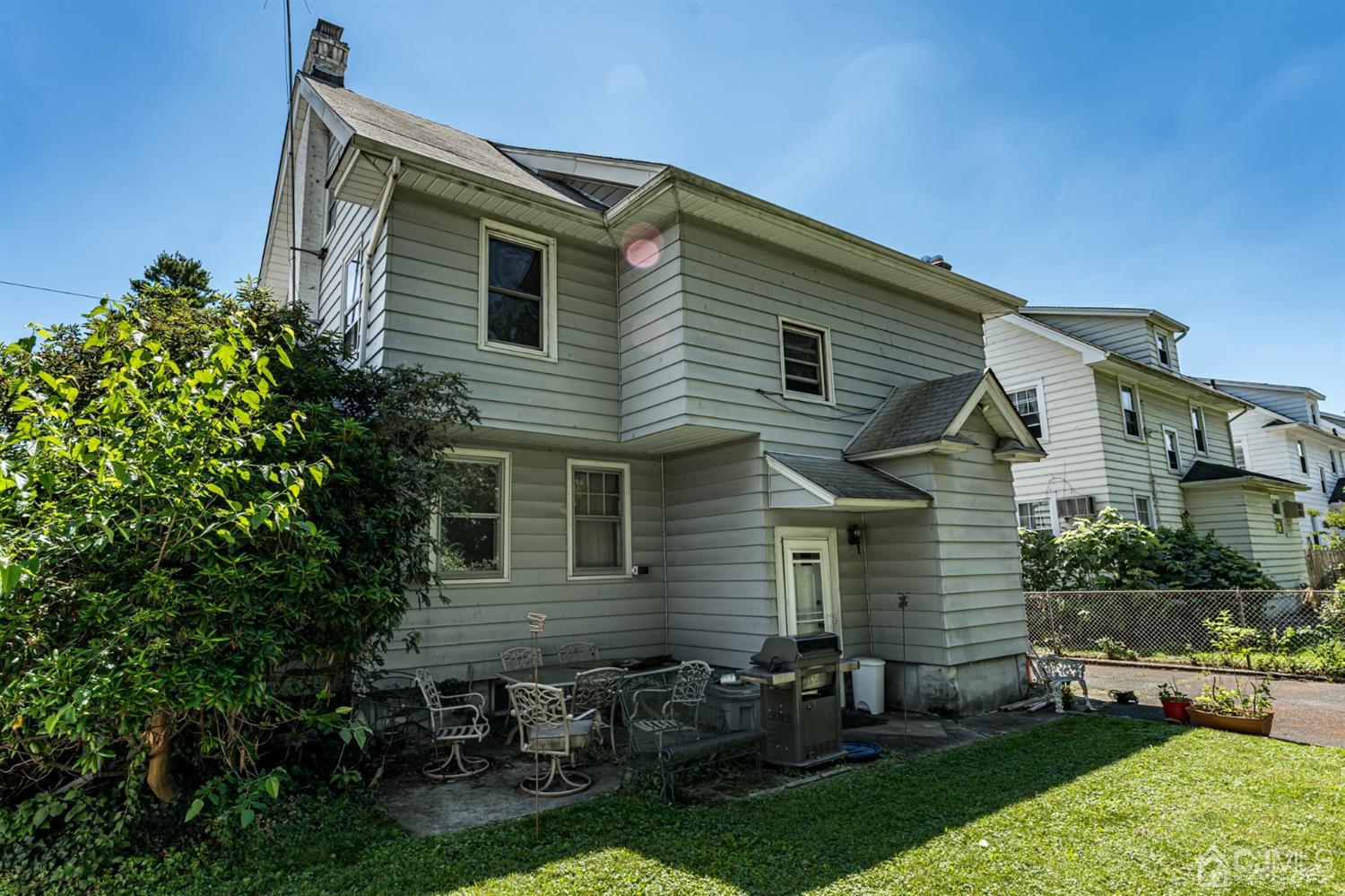 729 Livingston Road Elizabeth, NJ 07208 - Photo 25 of 26 a front view of house with yard and outdoor seating