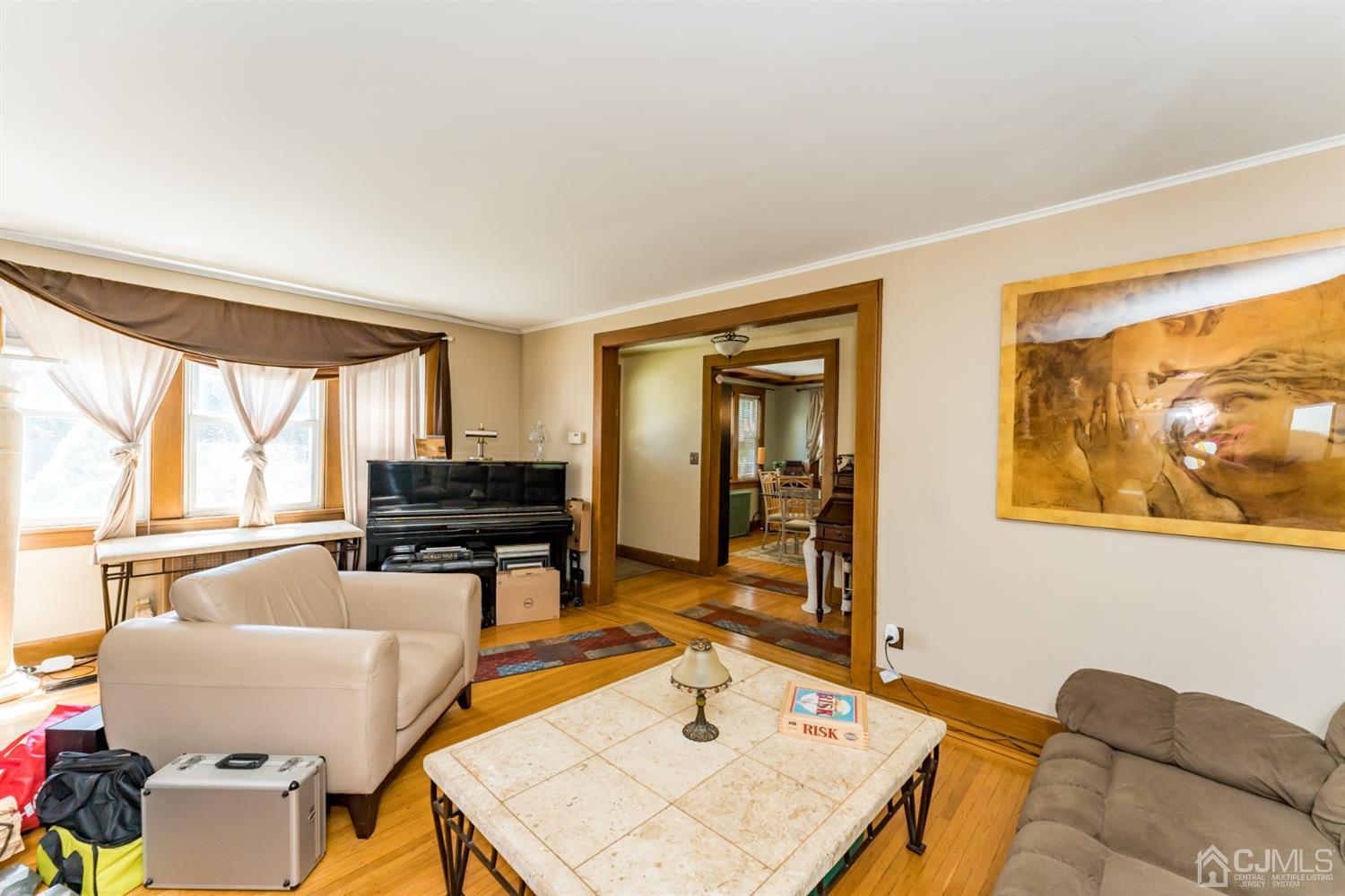 729 Livingston Road Elizabeth, NJ 07208 - Photo 4 of 26 a living room with furniture and a open kitchen view
