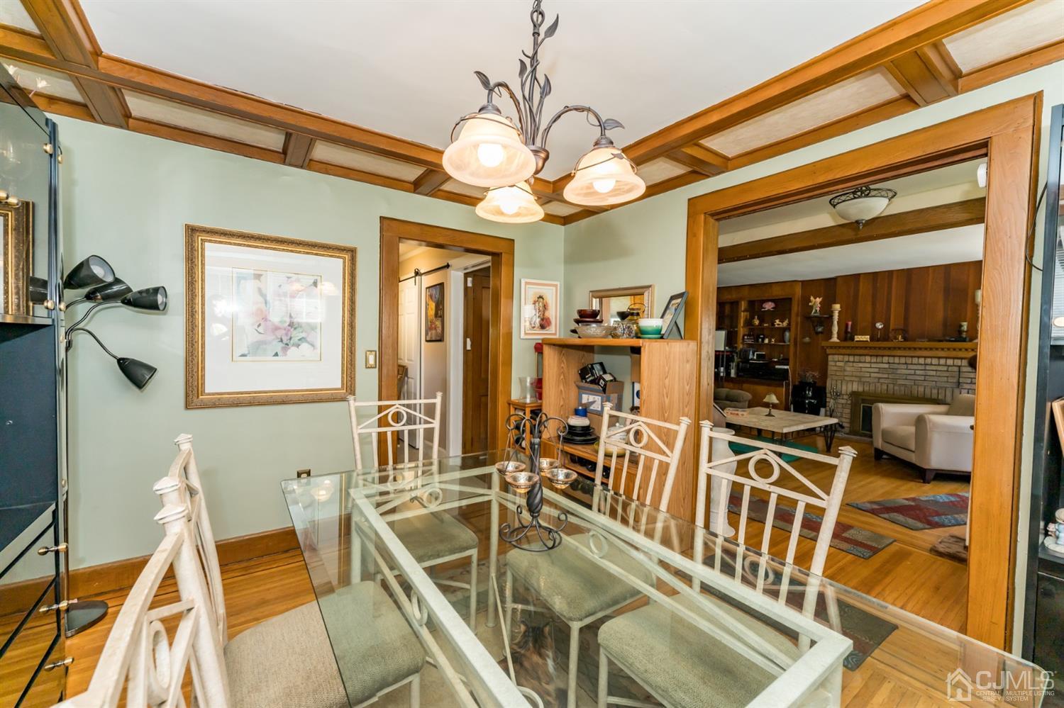 729 Livingston Road Elizabeth, NJ 07208 - Photo 6 of 26 a view of a dining room with furniture a chandelier and wooden floor