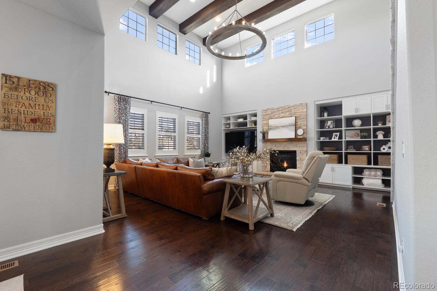 10800 Sundial Rim Road Highlands Ranch, CO 80126 - Photo 15 of 48 a living room with furniture and a fireplace