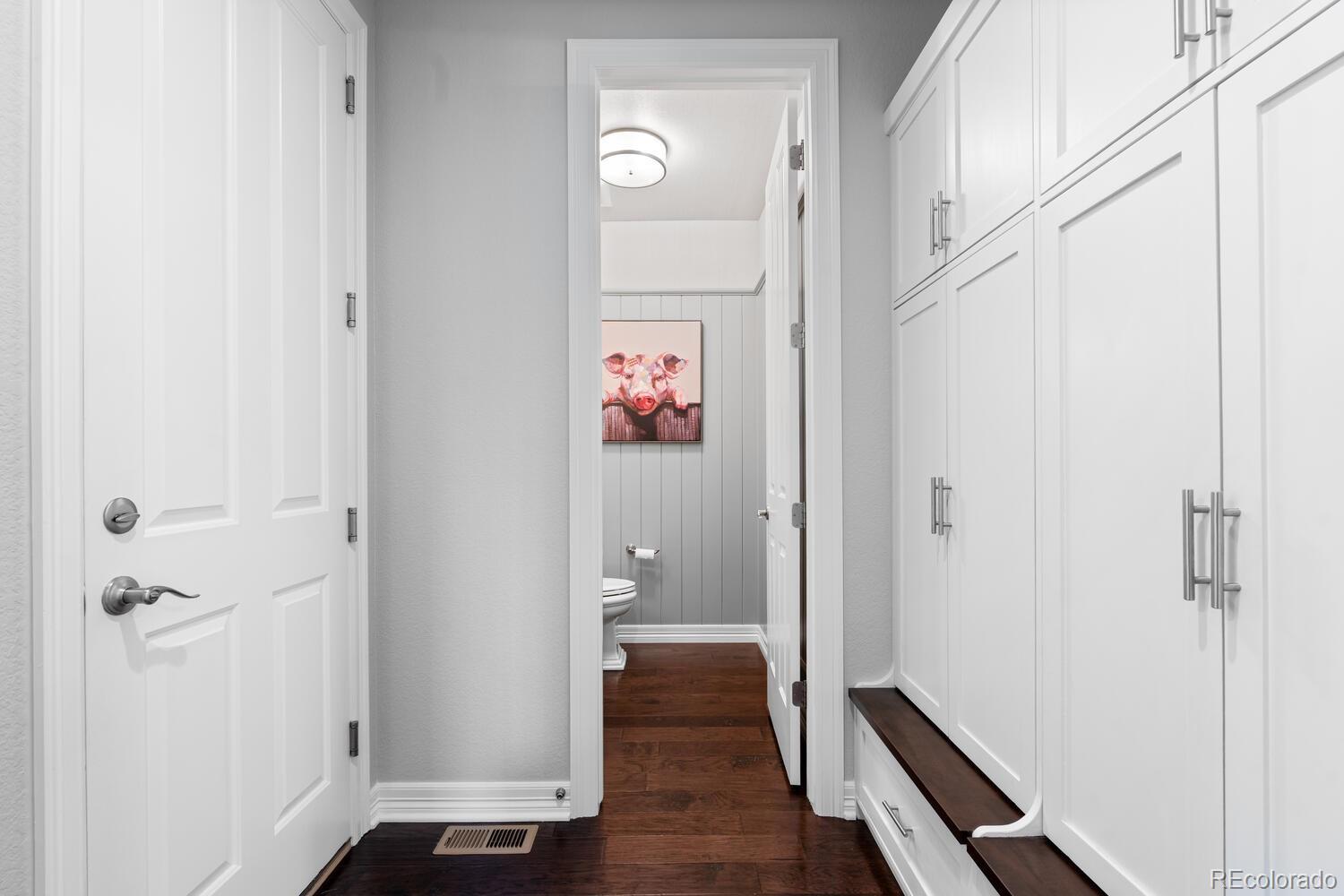 10800 Sundial Rim Road Highlands Ranch, CO 80126 - Photo 17 of 48 a view of a hallway with wooden floor and closet