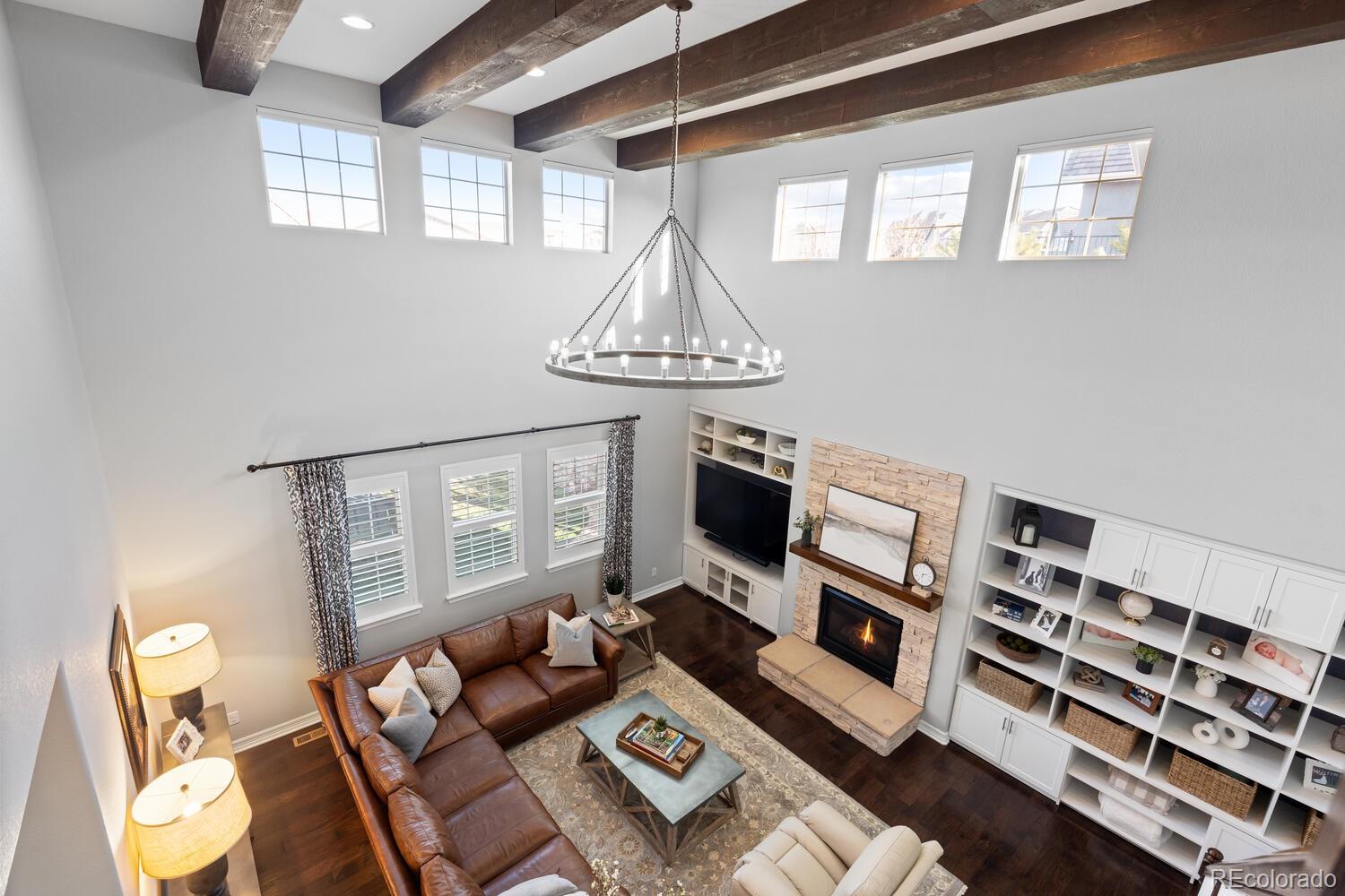 10800 Sundial Rim Road Highlands Ranch, CO 80126 - Photo 19 of 48 a living room with furniture a rug and a window