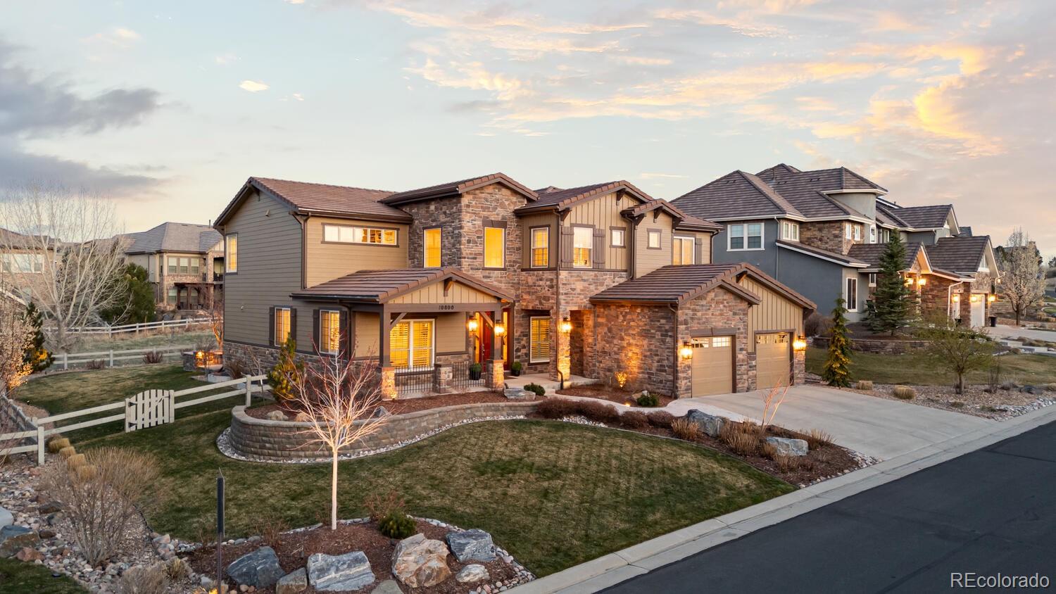 10800 Sundial Rim Road Highlands Ranch, CO 80126 - Photo 2 of 48 a front view of a house with garden