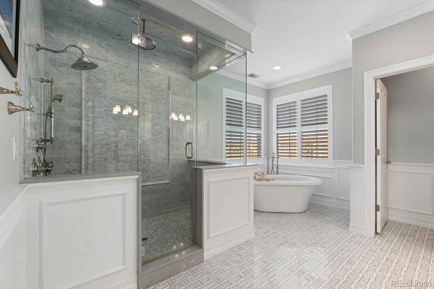 10800 Sundial Rim Road Highlands Ranch, CO 80126 - Photo 24 of 48 a bathroom with a granite countertop sink a toilet and shower