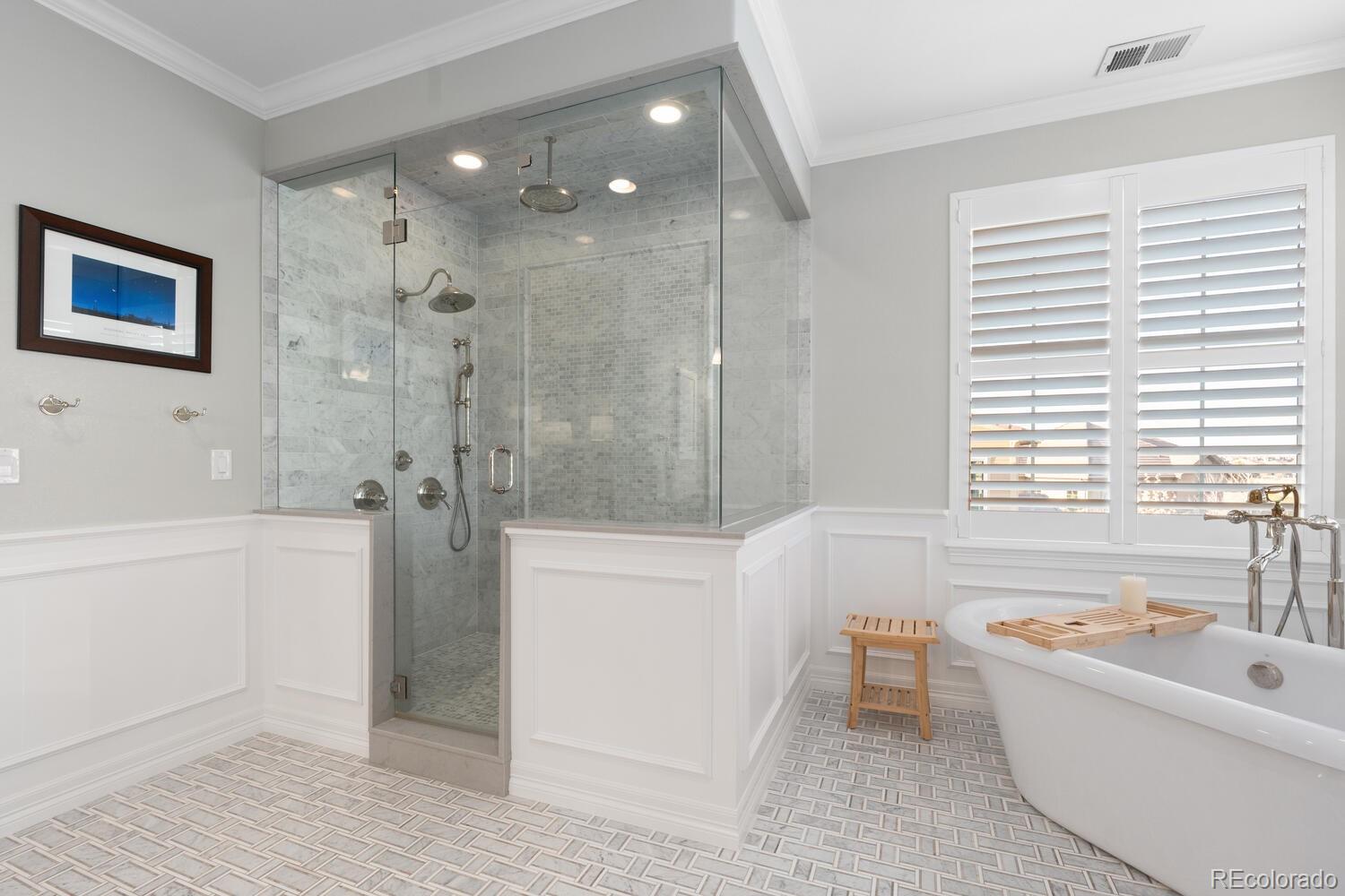 10800 Sundial Rim Road Highlands Ranch, CO 80126 - Photo 26 of 48 a bathroom with a bathtub a toilet a shower and vanity