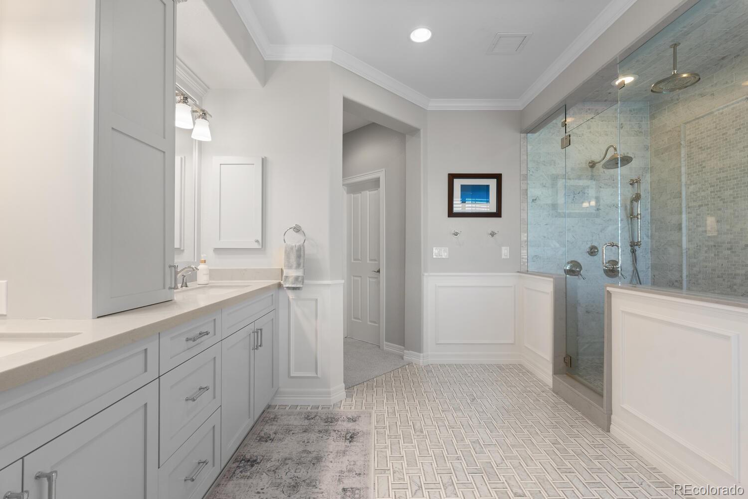 10800 Sundial Rim Road Highlands Ranch, CO 80126 - Photo 27 of 48 a spacious bathroom with a shower a sink and a mirror