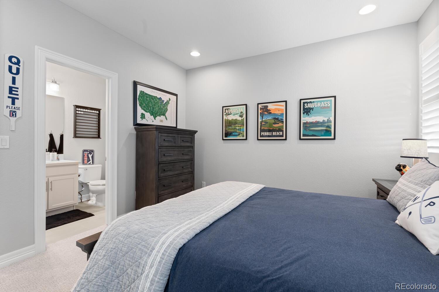 10800 Sundial Rim Road Highlands Ranch, CO 80126 - Photo 30 of 48 a bedroom with a bed and a view of bathroom