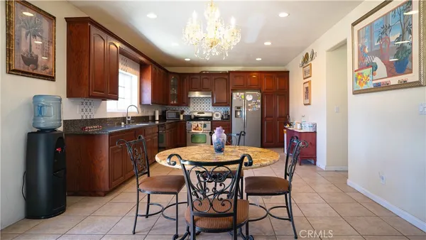 a dining room with furniture and window