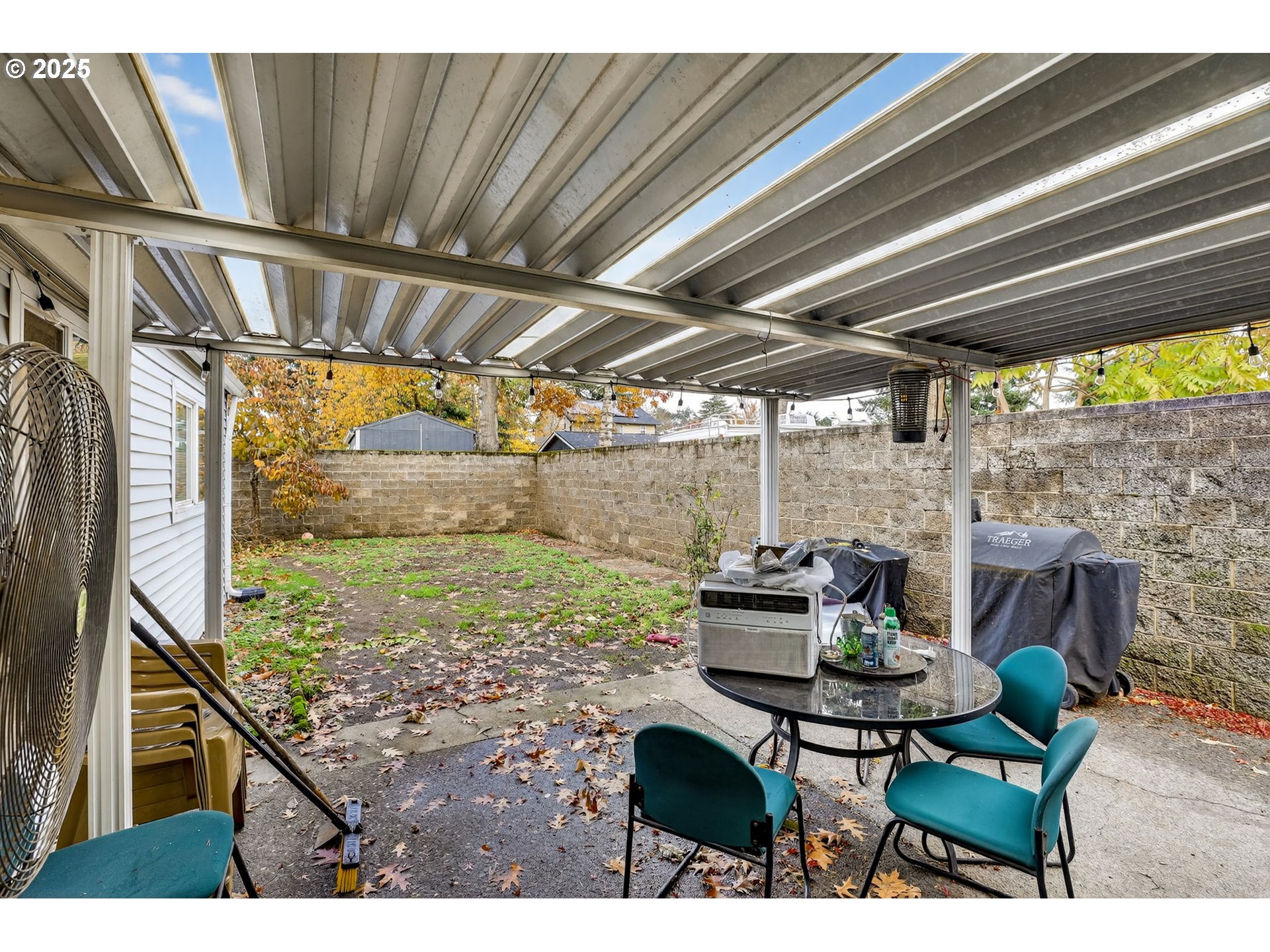 8739 Southeast Knapp Street Portland, OR 97266 - Photo 18 of 23 a living room with a couch a table and a potted plant
