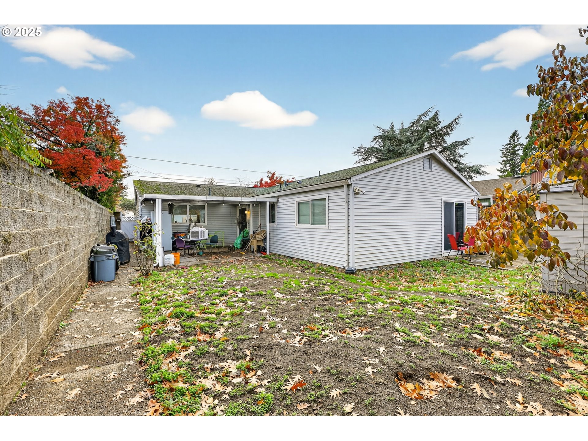 8739 Southeast Knapp Street Portland, OR 97266 - Photo 20 of 23 a view of a house with backyard